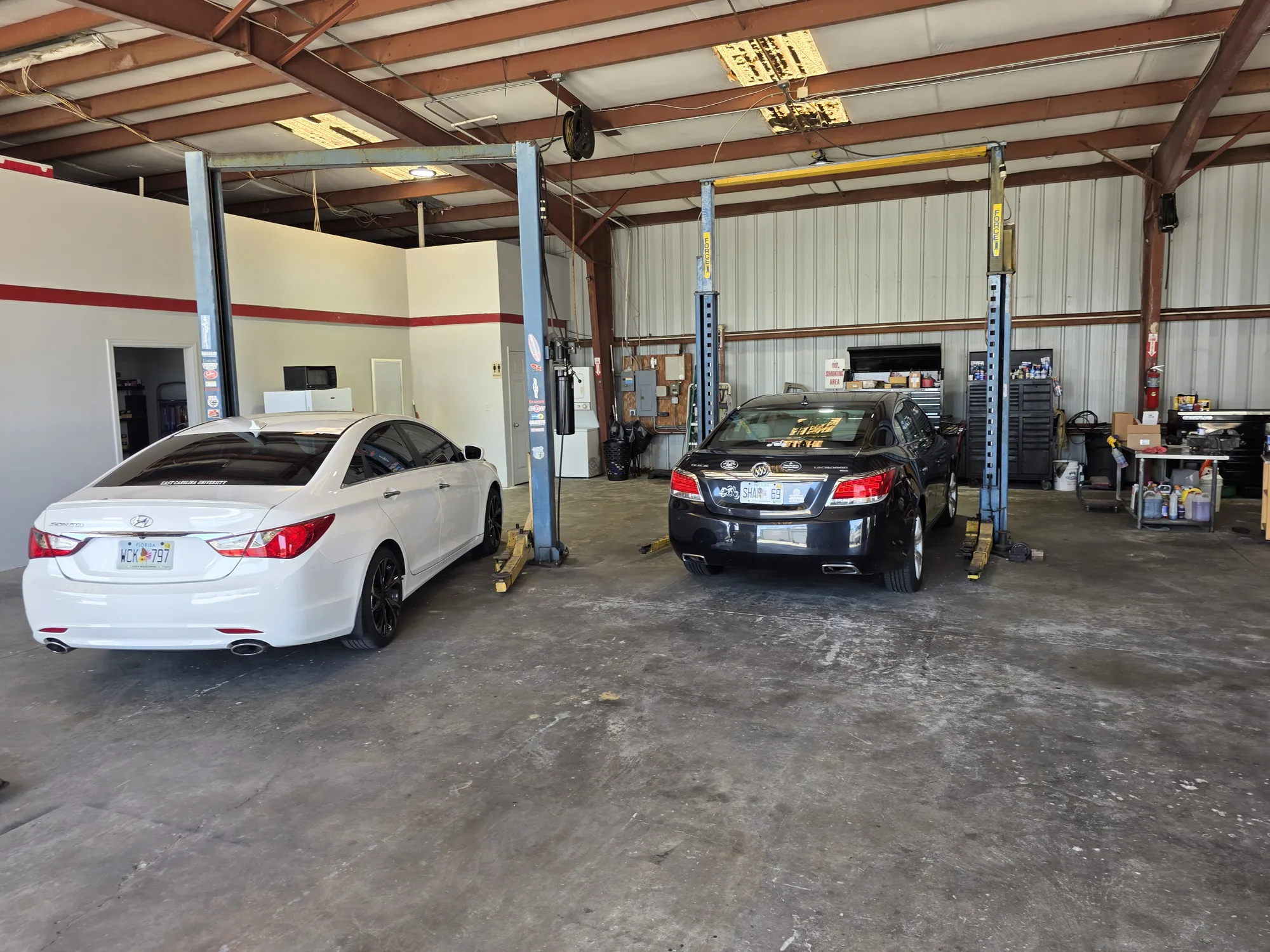 Multiple vehicle lifts inside Mike's Expert Auto Repair