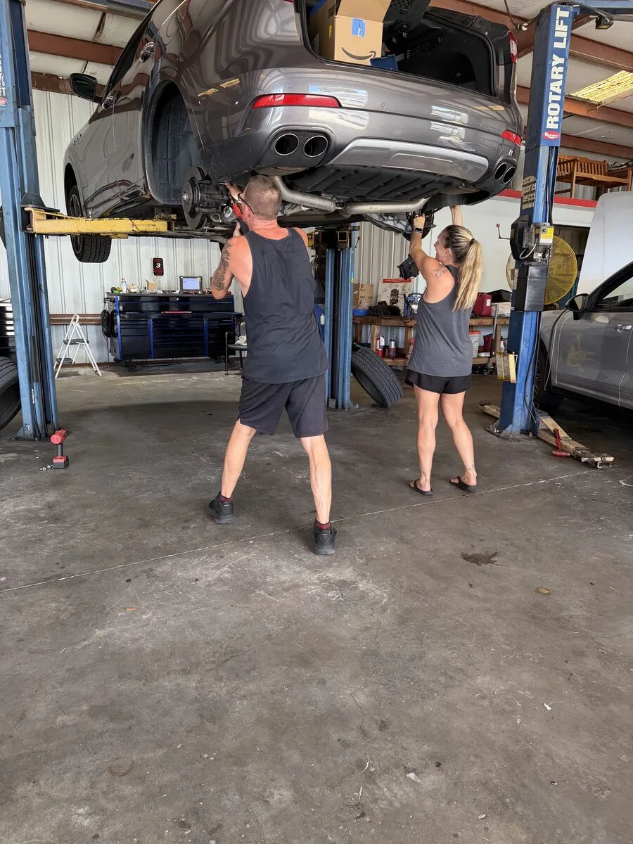 Mike's Expert Auto Repair technicians working on a vehicle in the new shop