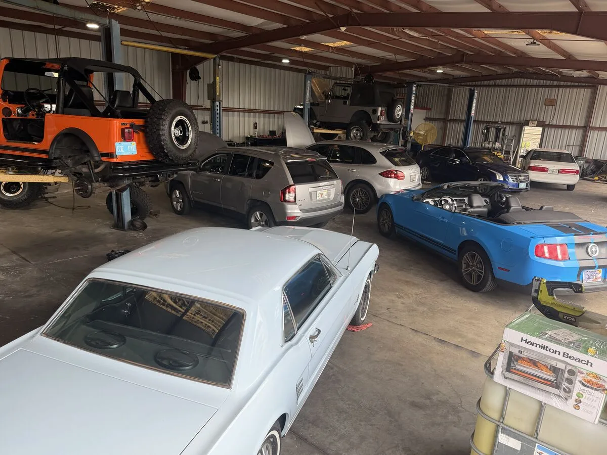 Mike's Expert Auto Repair shop filled with customer vehicles